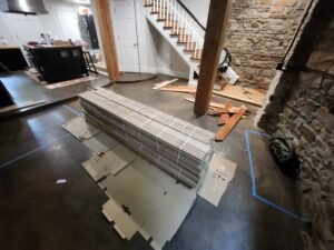 Stack of hardwood flooring in room