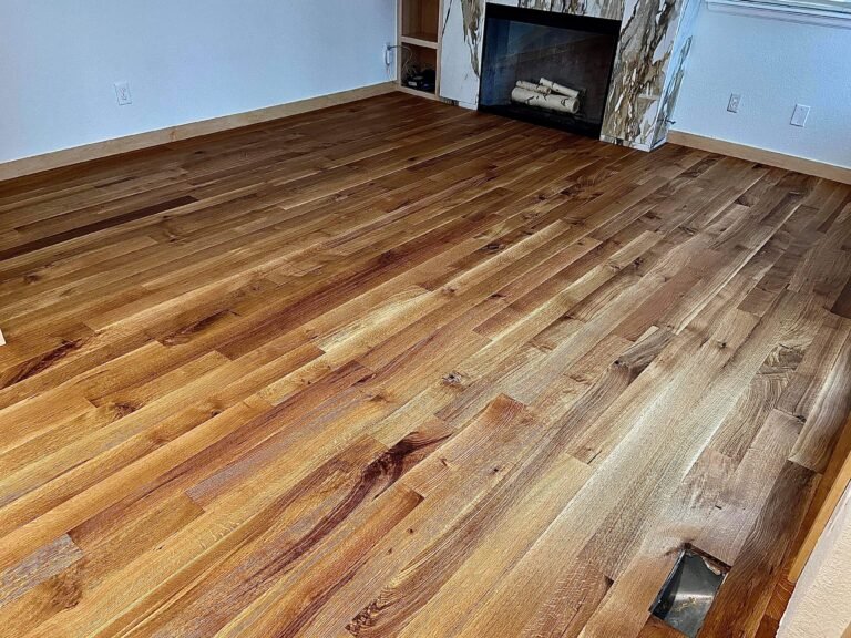 Polished wooden floor with fireplace.
