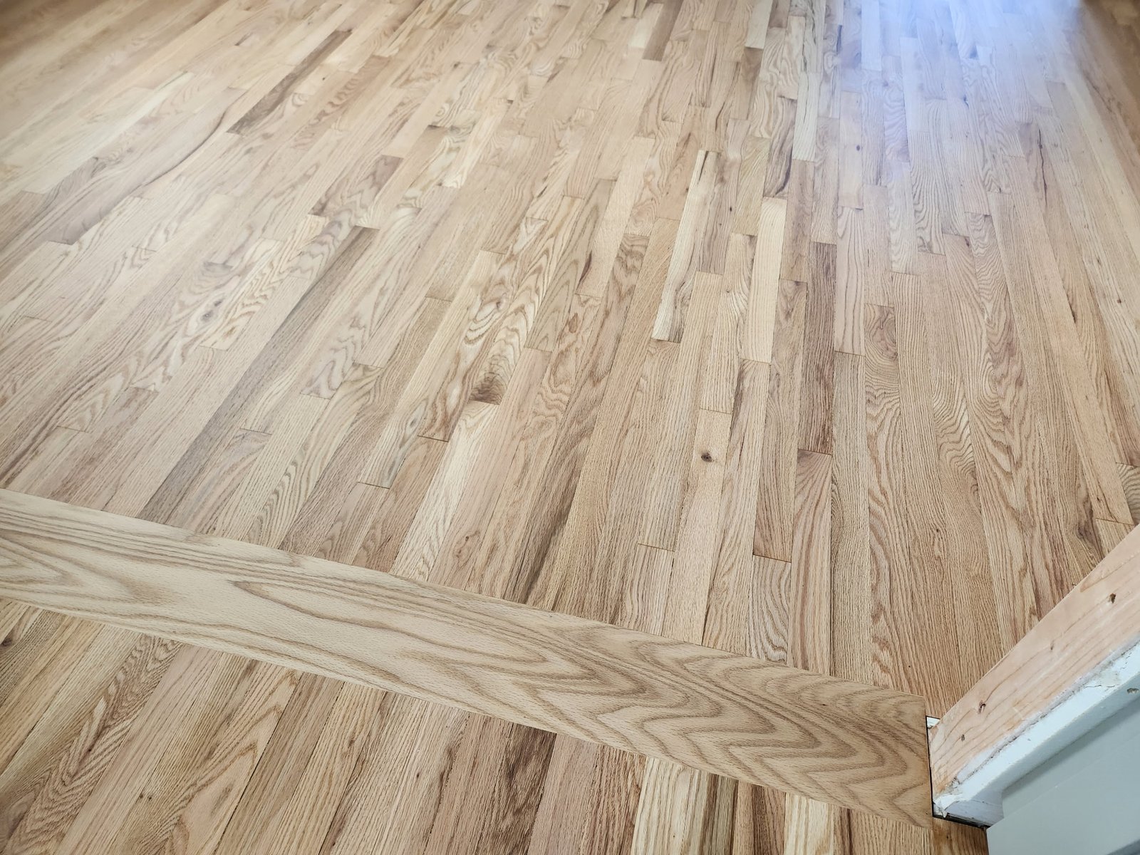 Red oak natural color in traditional home - warm tones and prominent grain